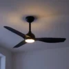 claro-whisper-dc-48-inch-ceiling-fan-black-with-led-light-on-close-up-on-dark-background