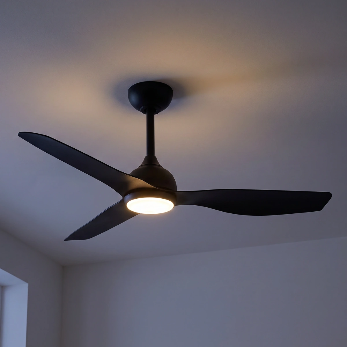 claro-whisper-dc-48-inch-ceiling-fan-black-with-led-light-on-close-up-on-dark-background